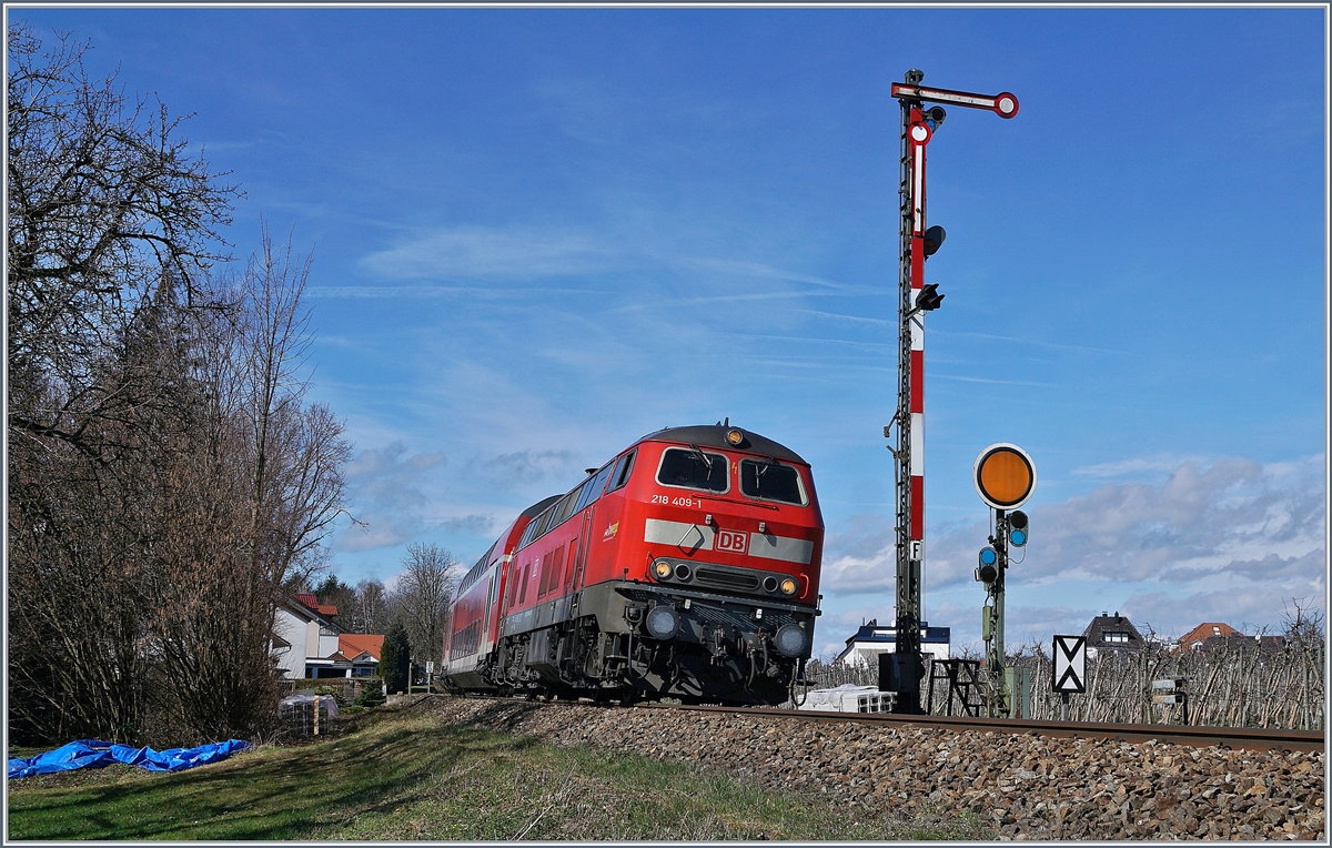 Die DB 218 409-1 mit ihrem RE von Aulendorf nach Lindau bei Einfahrsignal F von Nonnenhorn.

16. März 2019 
