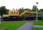 Der 15t-Schienendrehkran (BA 116  Wyhlen), DB 6808 Frankfurt / Glb Hanau (ex 	3080 974 0 092-0)  mit dem Kranschutzwagen (BA 815), DB 6913 Frankfurt (ex 978 0 021), am 02.10.2010 im Technik Museum Speyer.

Der Kran wurde 1957 von der Eisenbau Wyhlen AG unter der Fabriknummer 32004/1 gebaut. Das 5-achsige Fahrgestell wurde 1957 von der Georgsmarienhütte gebaut.
