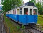Ehemaliger MOB Triebzug De 4/4 26 mit B4 61 am 28.05.2012 in Saanen, aufgenommen aus fahrendem Zug.