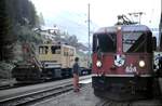 RhB Ge 4/4 II Nr.624 und Tm 2/2 Nr.83 in Berg�n im August 1990.