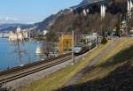 TGV Lyria (112) der Verbindung Paris–Dijon–Lausanne–Brig bediehnt, er f�hrt hier am 26.02.2012 bei  Clos du Moulin am Genfersee Richtung Brig entlang, hinten Ch�teau de Chillon,